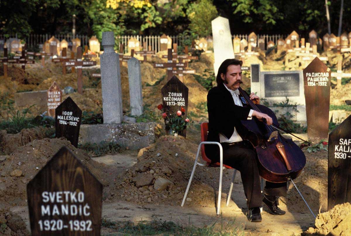 Vedran Smalovic, a cellist, playing a requiem for the for the victims of Siege of Sarajevo at Lav Cemetery