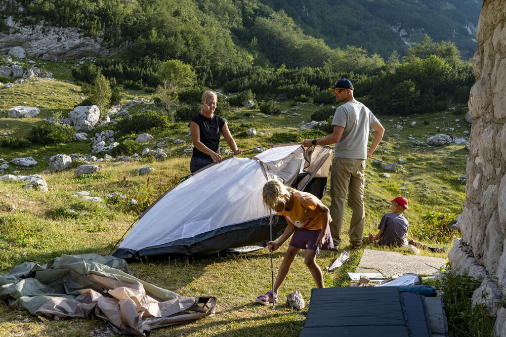 Setting up a tent nearby the abandoned mountain hut at Skrka valley - Durmitor National Park