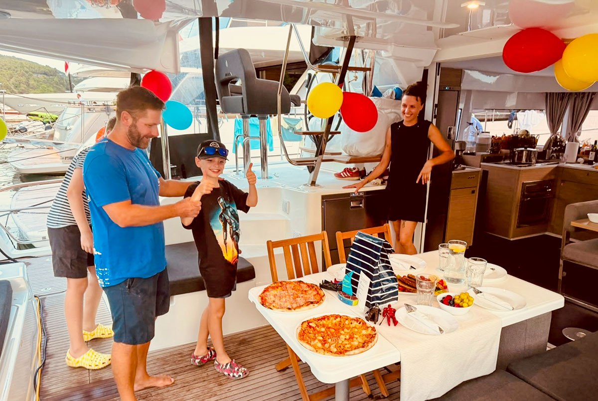 Birthday celebration with balloons and food on the cockpit table