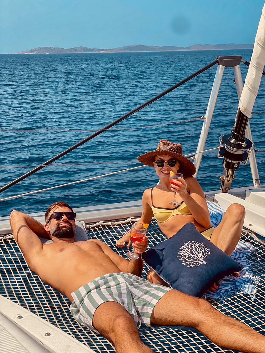 Two guests relaxing on the bow net